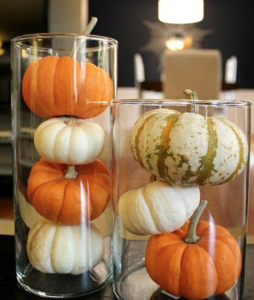 vases filled with mini pumpkins