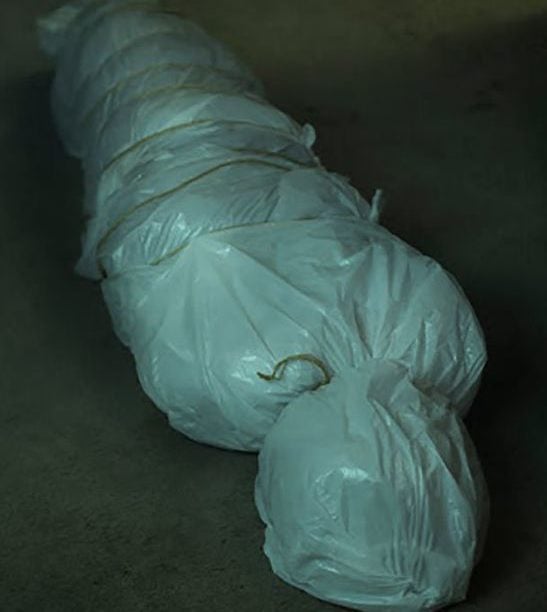 Faux Body Bag halloween decoration made from trash