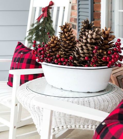 Frugal Christmas Porch with rocking chairs and tartan pillows