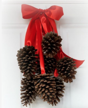 red bow with hanging Pinecone Cluster for the front door