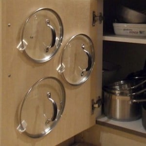 Lid Storage using command hooks on the back of kitchen cabinet