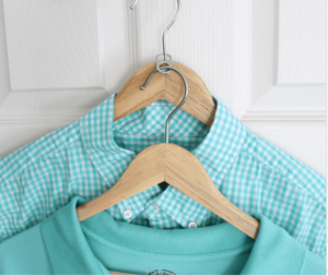 stacking shirts with Soda Tabs on a coat hanger