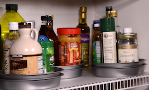 Dollar Store DIY Lazy Susan kitchen organization for bottles