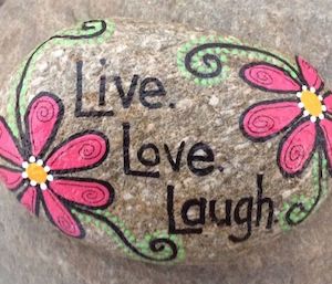 live love laugh rock with flowers on the side