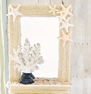 Rope Lined Mirror with starfish coastal decorating idea