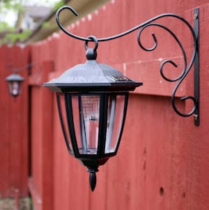 Dollar Store Hanging Lanterns from backyard fence