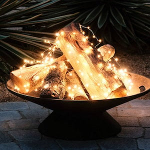 Faux Fire Pit with string lights and wood