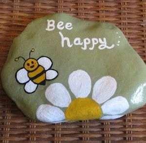 Be Happy Word stone with a bee and a flower at the bottom