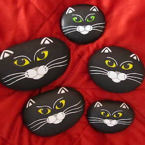 rocks painted with cat faces