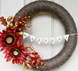 Yarn Fall Wreath with harvest banner and fall florals