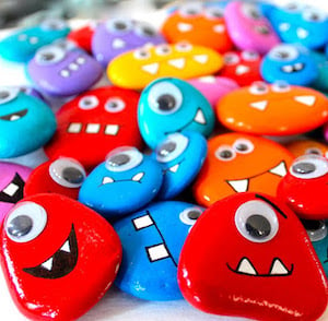 rocks painted with monster faces