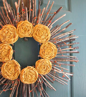 autumn stick wreath with fabric flowers