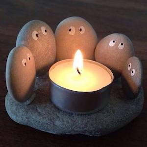 stones Huddled Around a tea light candle