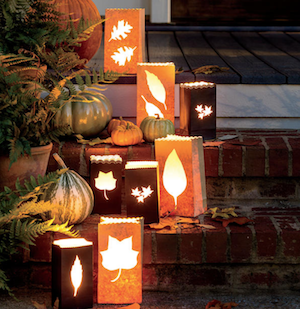 Paper Luminaries with fall leaves lining porch stairs