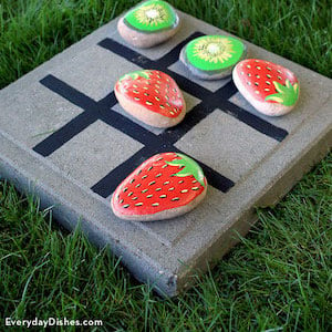 Fruit rocks on a tic tac toe board