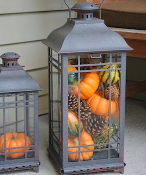 fall lantern filled with pumpkins, gourds and pinecones