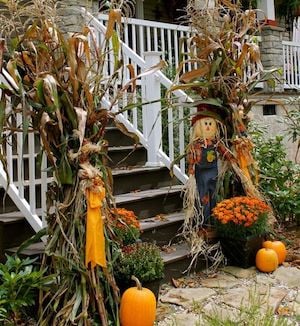 Fall Corn Stalks on Porch Stair Rails Decor idea