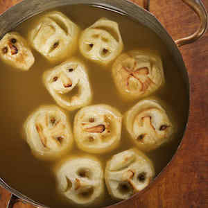 Shrunken Heads in apple Cider halloween drink for a party 