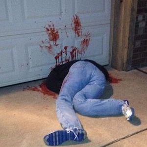 Person Under Garage Door outdoor halloween decoration
