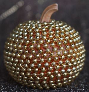 Gold bead wrapped pumpkin