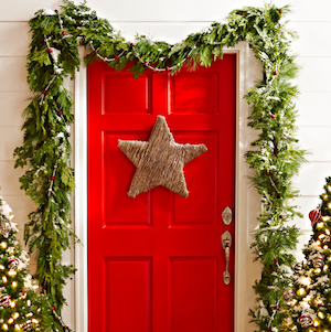 Twin star door hanger with green garland around the door