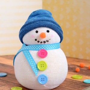 Manualidades de muñeco de nieve con calcetín sin costuras para adultos