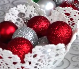 Doily Christmas Basket filled with christmas ornaments 