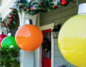 Giant Hanging Christmas Ornaments on the porch
