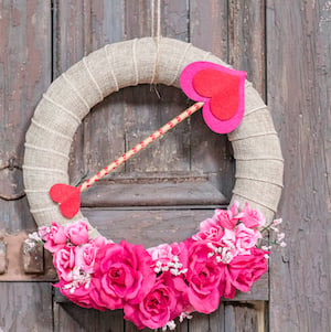 Dollar Store Valentine Wreath with burlap ribbon and pink flowers