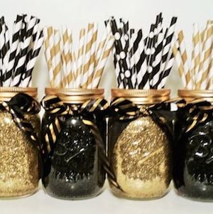 Black and Gold Mason Jars New Years eve decoration holding paper straws
