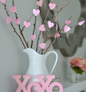 Cute (and Cheap!) Vase Decoration with paper hearts attached to twigs