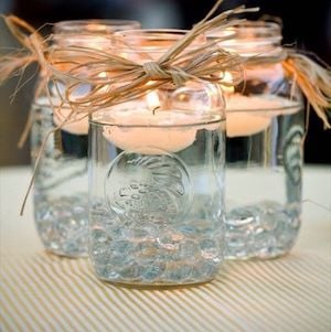 Mason Jar Raffia Candle Holder with floating candles in water