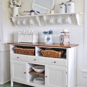 Kitchen buffet table with rack above for Ceramics mugs 