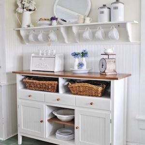 Kitchen buffet table with rack above for Ceramics mugs