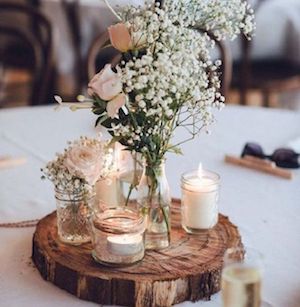 Candles and Baby's Breath on a Wood Slice