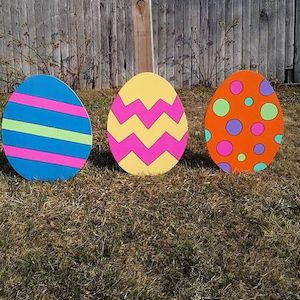 Large Wood Egg Stakes in the yard
