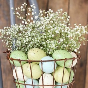 Dollar Tree wire basket with easter eggs and baby's breath Decoration