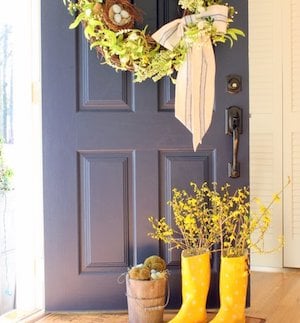 Rain Boot Vase with flowers in it on the Front Porch