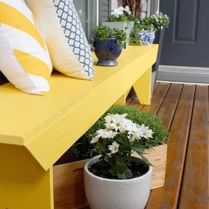 yellow bench on front porch