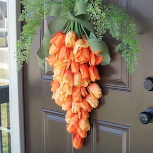 Carrot-shaped wreath of orange flowers