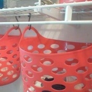 Organizational Basks hanging Under Shelving in the laundry room