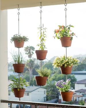 hanging clay pots on apartment balcony