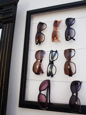 Wall closet organization using a picture frame and wire to hang sunglasses