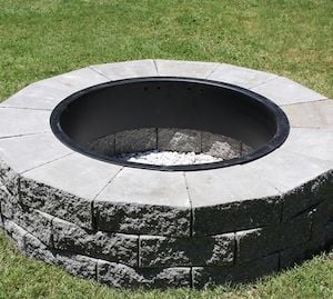 concrete landscaping stones fire pit with a metal fire pit ring