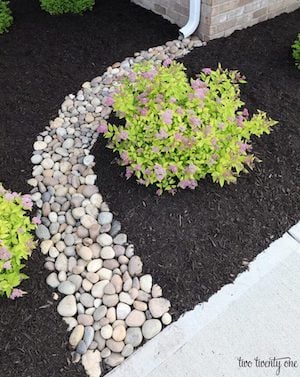 DIY pebbled Downspout Path curb appeal idea