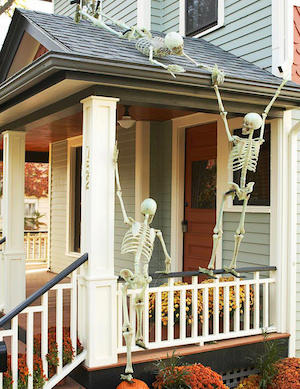 Skeletons Climbing porch for halloween