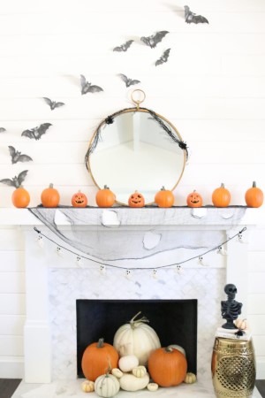 Modern Farmhouse Halloween Mantel with faux bats and mini pumpkins