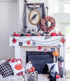 Halloween Mantel with framed crow, garland and wreath