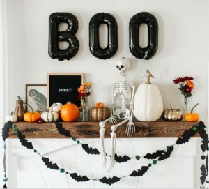 Modern Halloween Mante with bat garland and boo balloons 