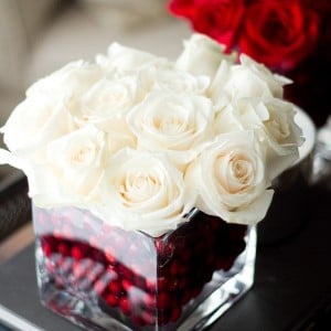 white Roses Centerpiece with cranberry filler 